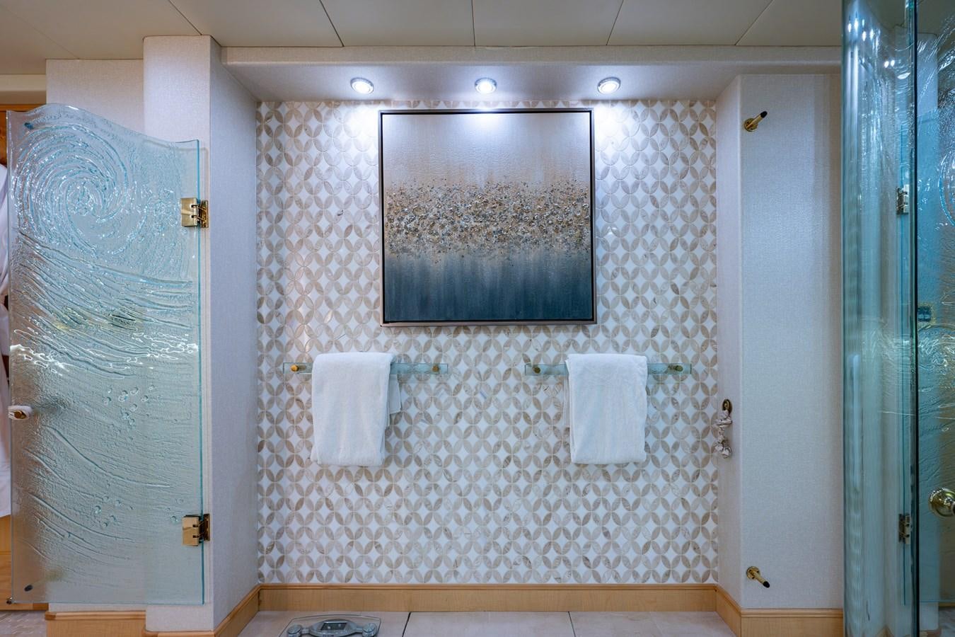 a bathroom with a glass shower aboard WIRE WE HERE Yacht for Sale