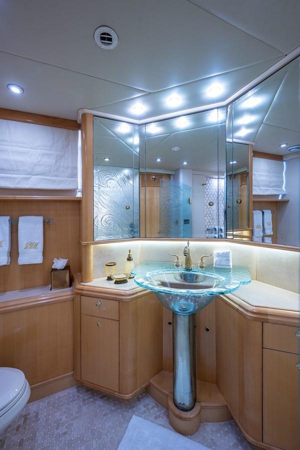 a bathroom with a sink and a mirror aboard WIRE WE HERE Yacht for Sale