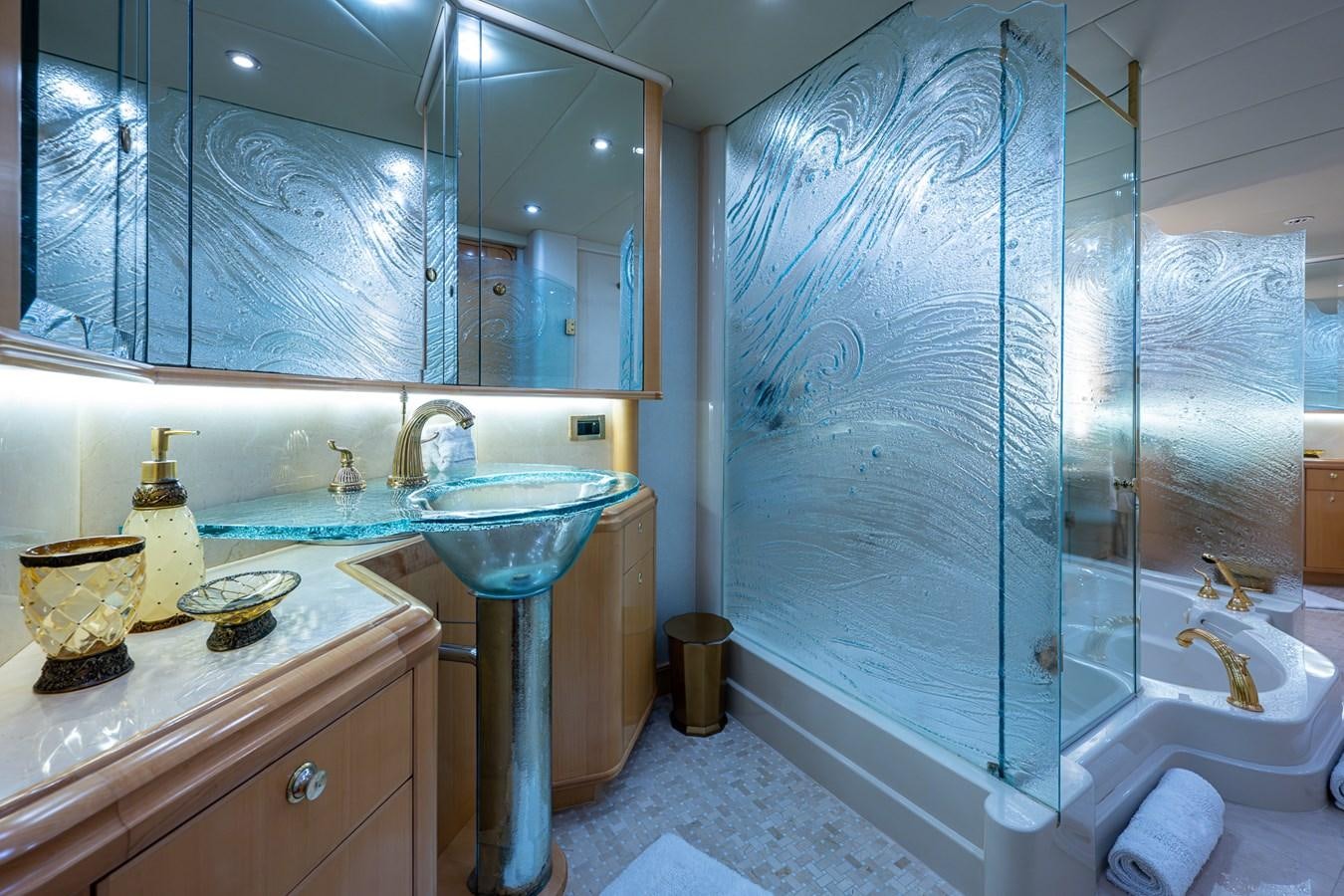 a bathroom with a glass shower aboard WIRE WE HERE Yacht for Sale