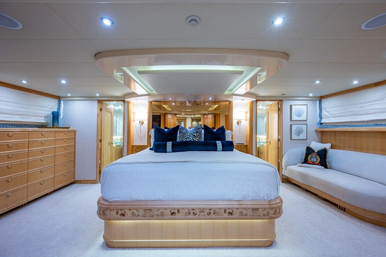 a bedroom with a bed and a dresser aboard WIRE WE HERE Yacht for Sale