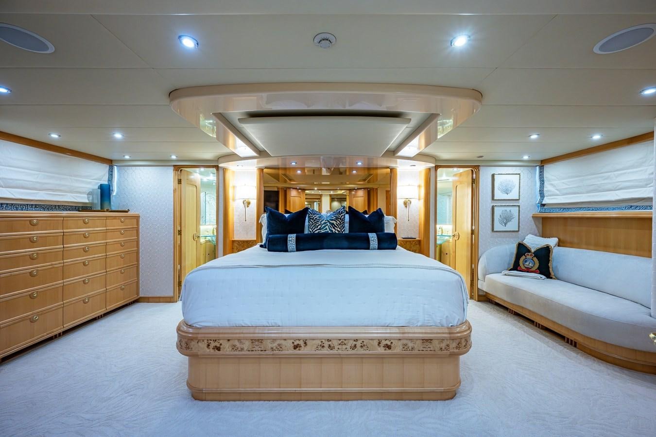 a bedroom with a bed and a couch aboard WIRE WE HERE Yacht for Sale