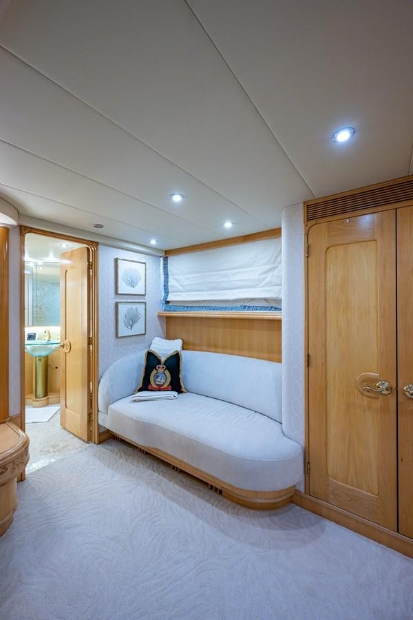 a bedroom with a bed and a closet aboard WIRE WE HERE Yacht for Sale