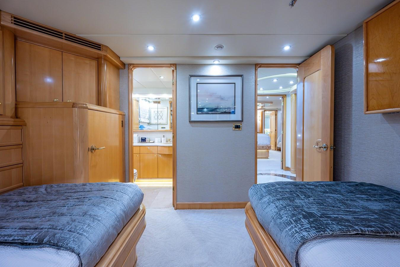 a bedroom with a bed and a closet aboard WIRE WE HERE Yacht for Sale