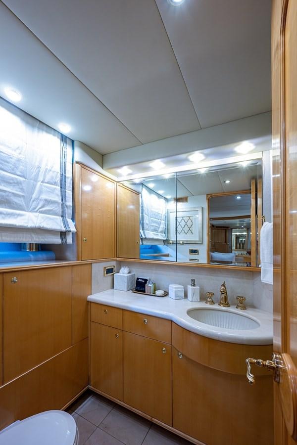 a bathroom with a large mirror aboard WIRE WE HERE Yacht for Sale