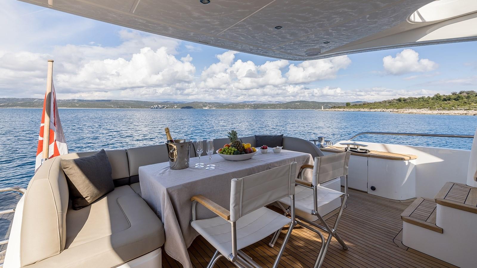 a table and chairs on a boat aboard SEA DREAM II Yacht for Sale