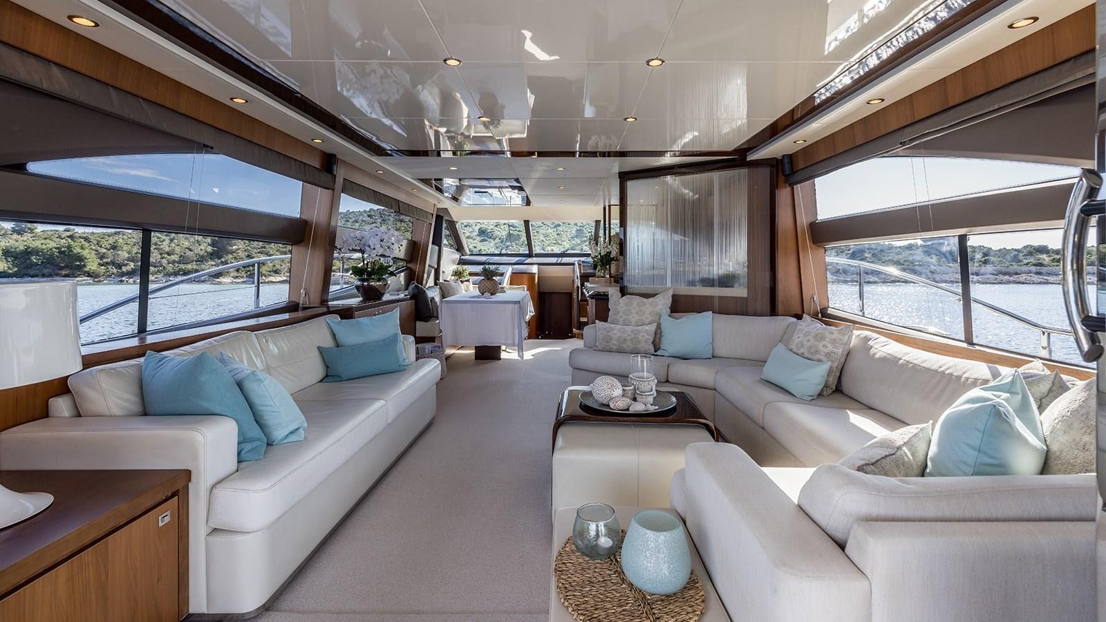 a living room with a couch and a coffee table aboard SEA DREAM II Yacht for Sale