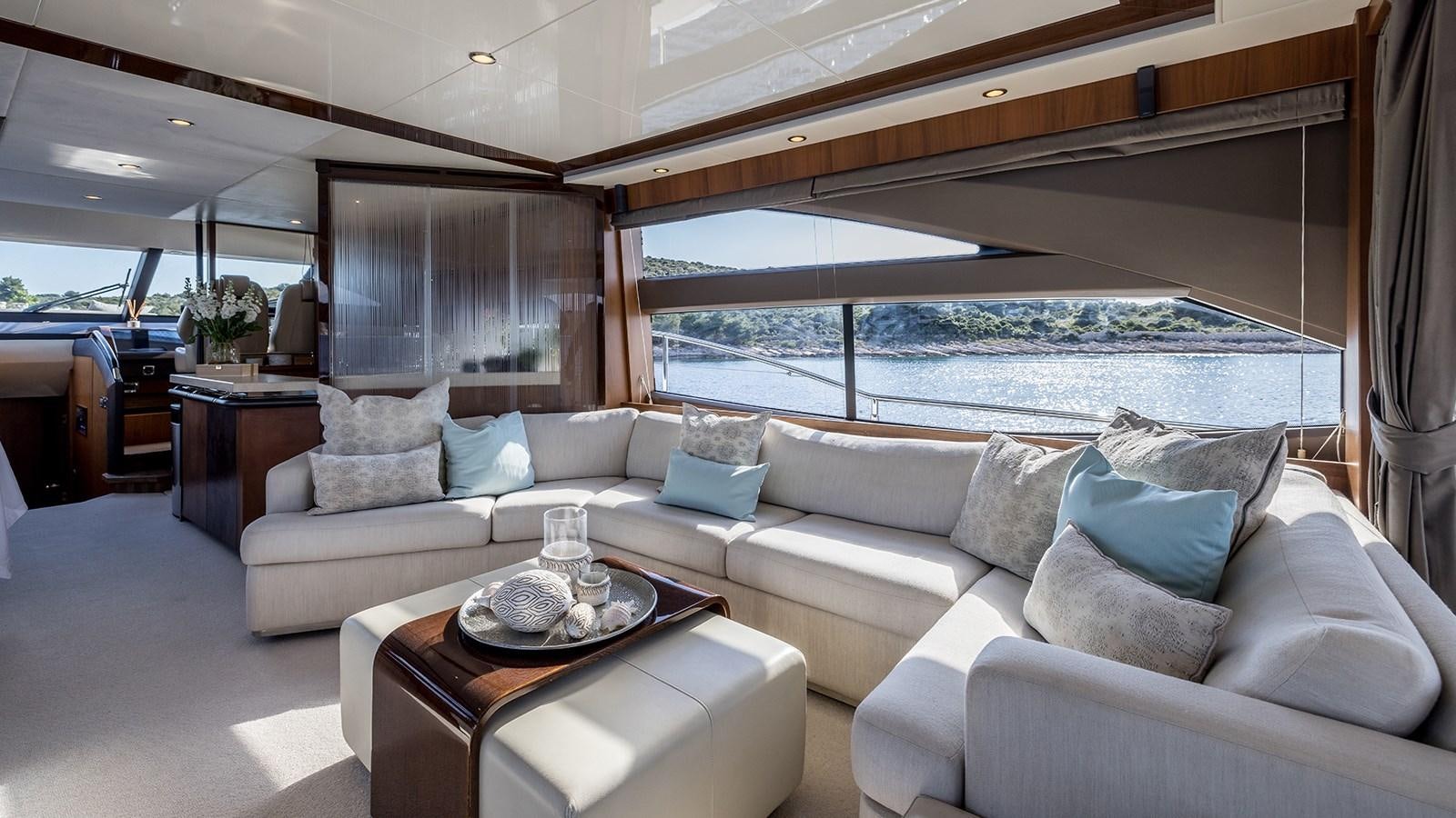 a living room with a large window aboard SEA DREAM II Yacht for Sale