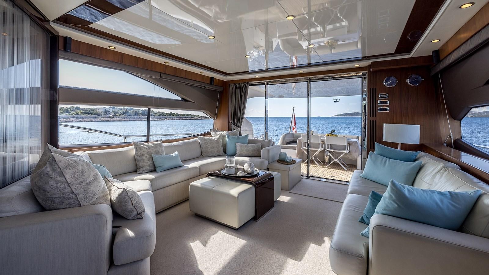 a living room with a large window aboard SEA DREAM II Yacht for Sale