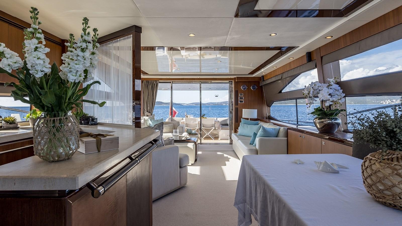 a large kitchen with a table and chairs aboard SEA DREAM II Yacht for Sale