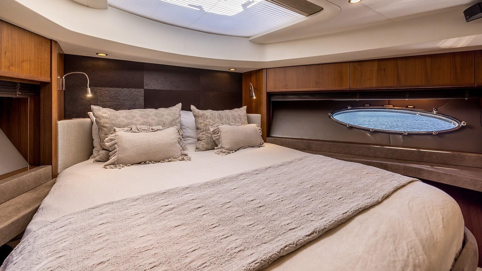 a large bed with a pool table aboard SEA DREAM II Yacht for Sale