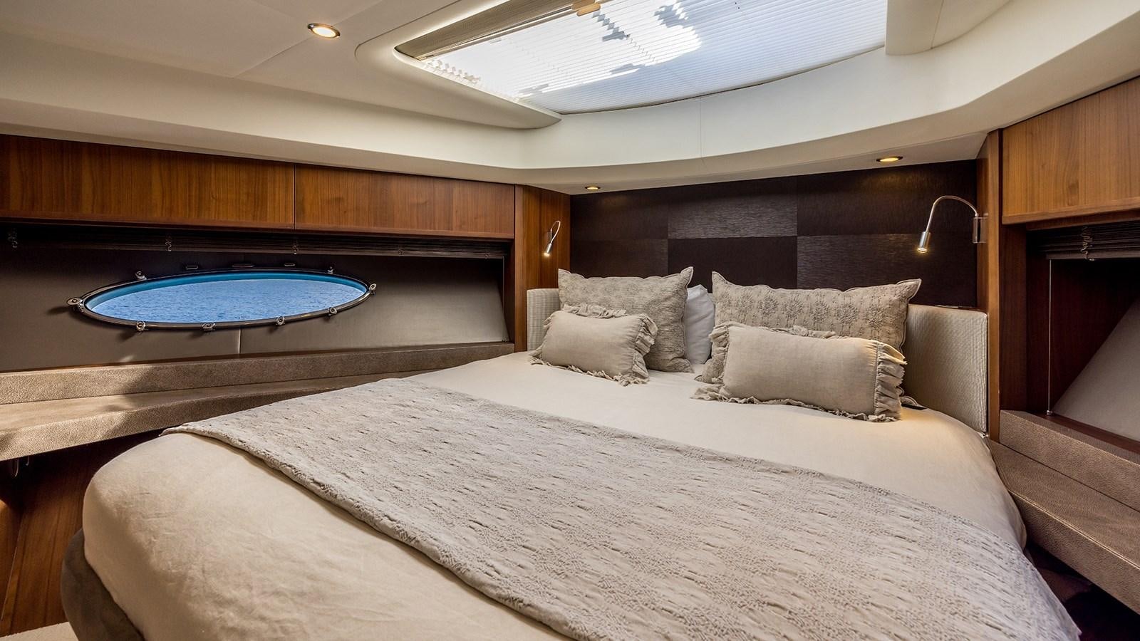 a bed with a pool table aboard SEA DREAM II Yacht for Sale