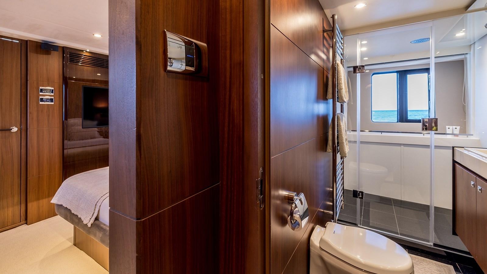 a bathroom with a toilet and a sink aboard SEA DREAM II Yacht for Sale