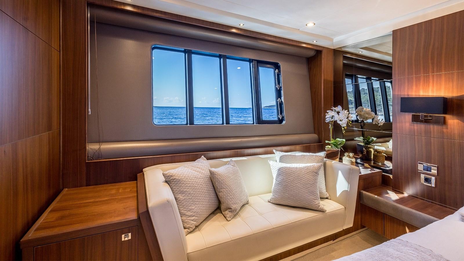a room with a bed and a window aboard SEA DREAM II Yacht for Sale