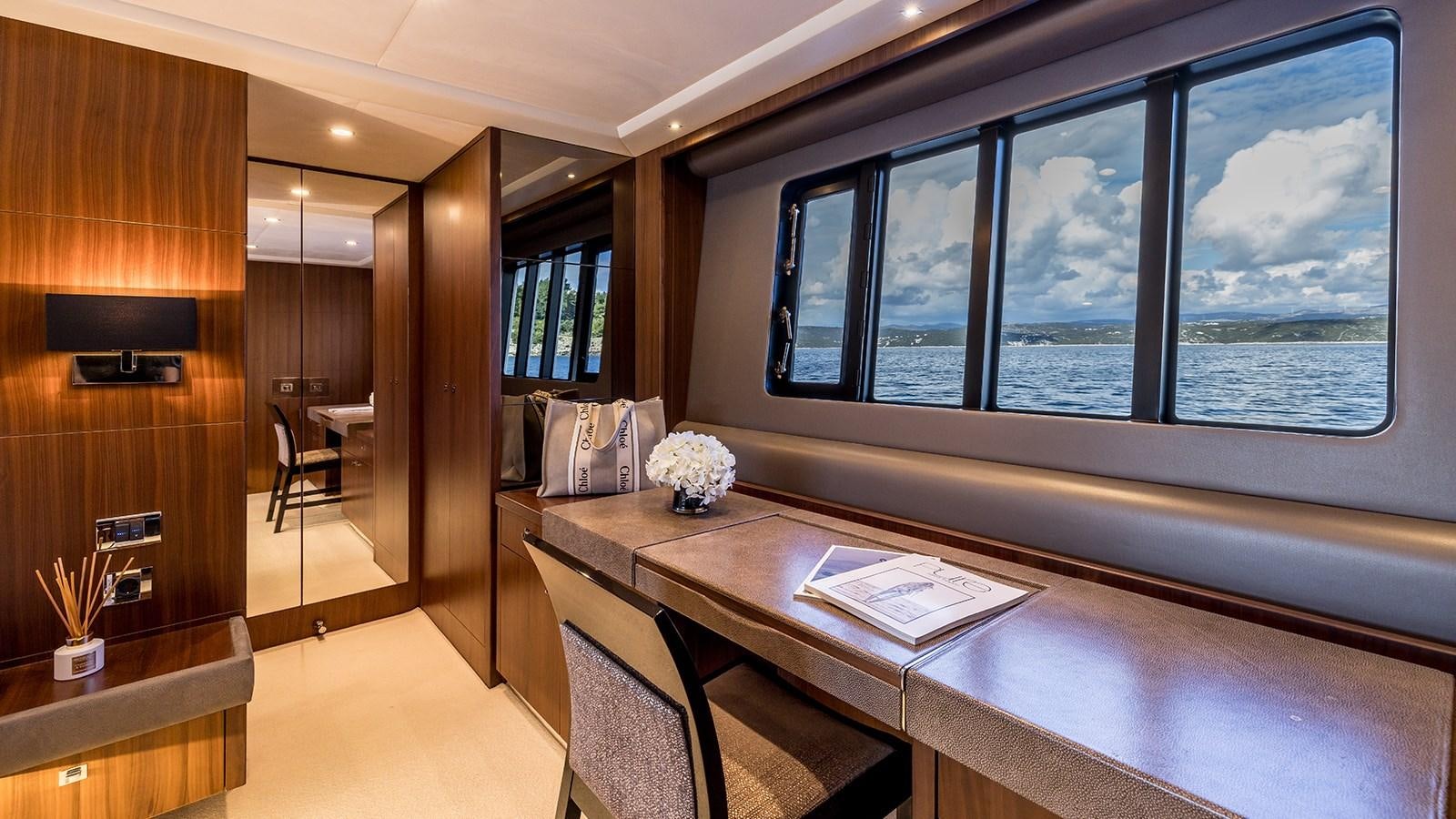 a room with a table and chairs aboard SEA DREAM II Yacht for Sale