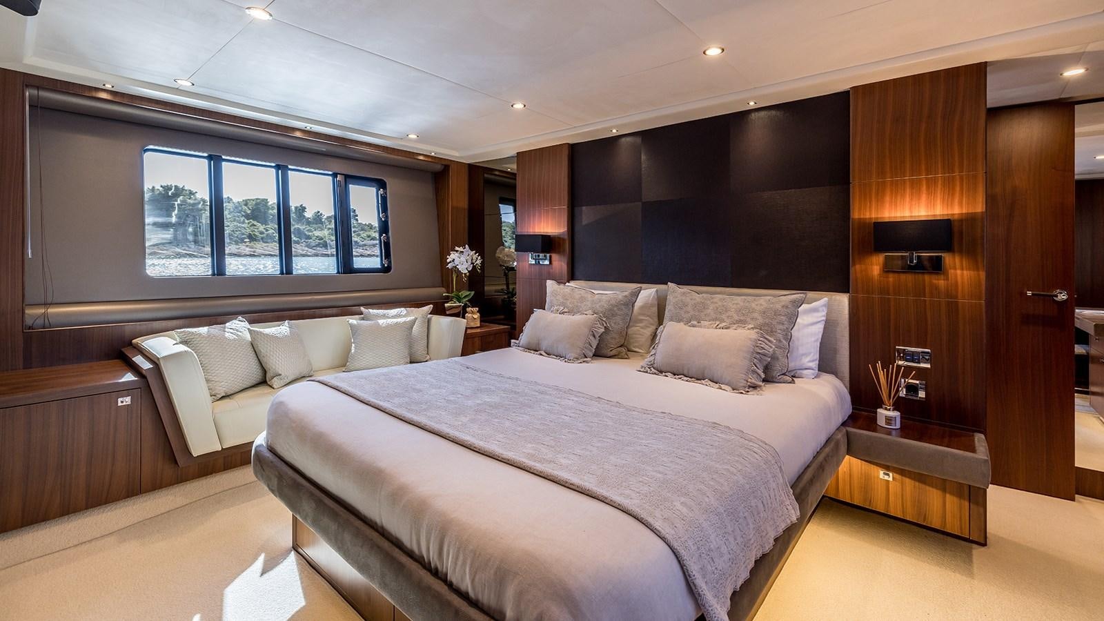 a large bed in a room aboard SEA DREAM II Yacht for Sale