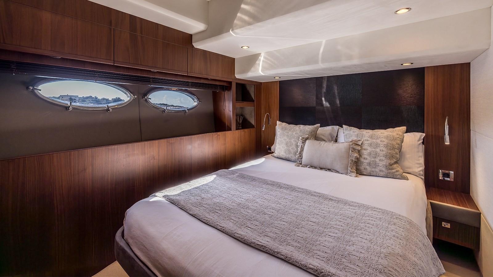 a bed in a room aboard SEA DREAM II Yacht for Sale