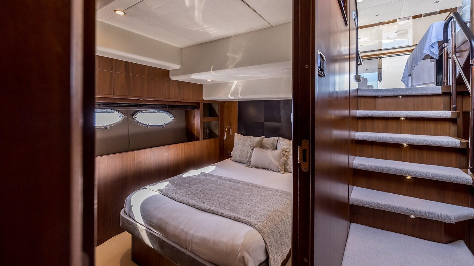 a bed in a room aboard SEA DREAM II Yacht for Sale