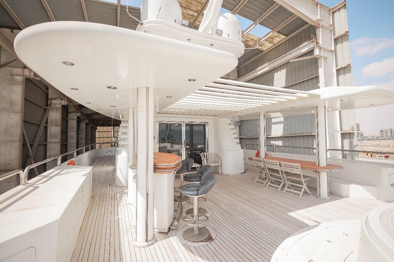 a large white tent with tables and chairs aboard 2008 OCEANDRO 48M CUSTOM Yacht for Sale