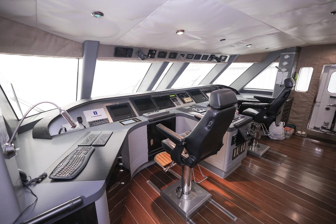 a room with a large desk and chairs aboard 2008 OCEANDRO 48M CUSTOM Yacht for Sale