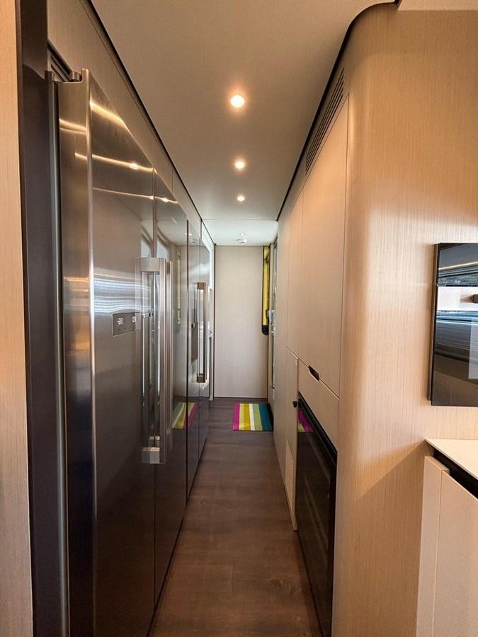 a hallway with a door and windows aboard LONG TENG Yacht for Sale