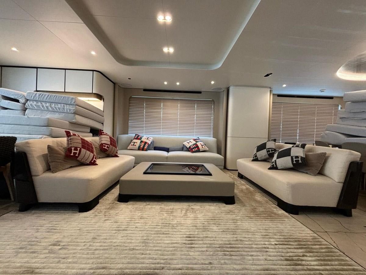 a living room with white furniture aboard LONG TENG Yacht for Sale