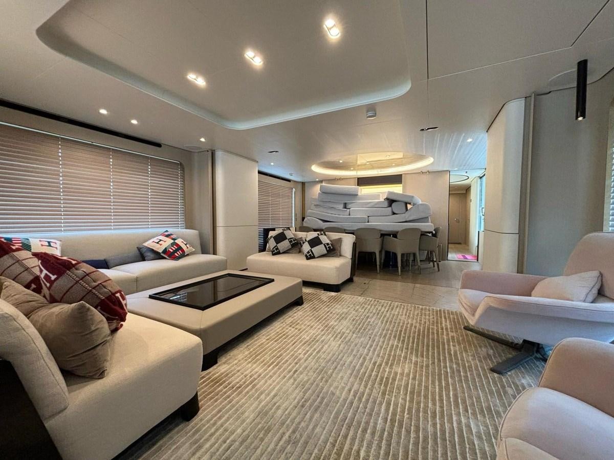 a living room with a couch and a table aboard LONG TENG Yacht for Sale
