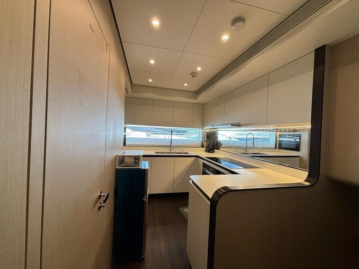 a room with a desk and computer aboard LONG TENG Yacht for Sale