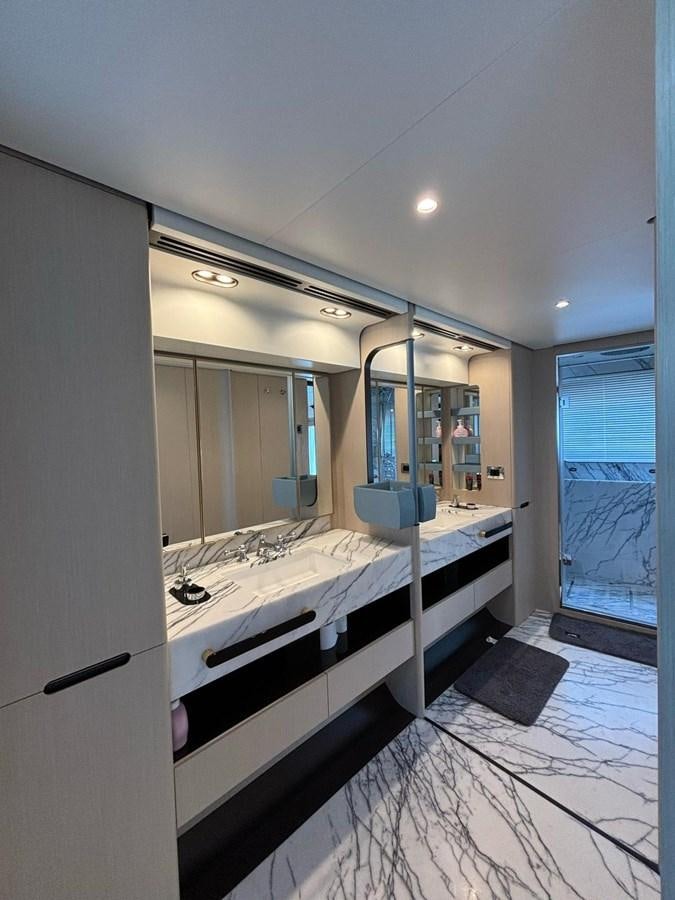a large bathroom with a large mirror aboard LONG TENG Yacht for Sale