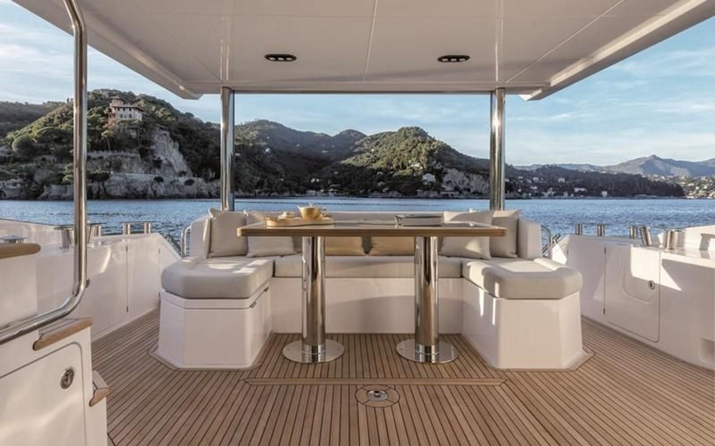 a room with a table and chairs aboard LONG TENG Yacht for Sale