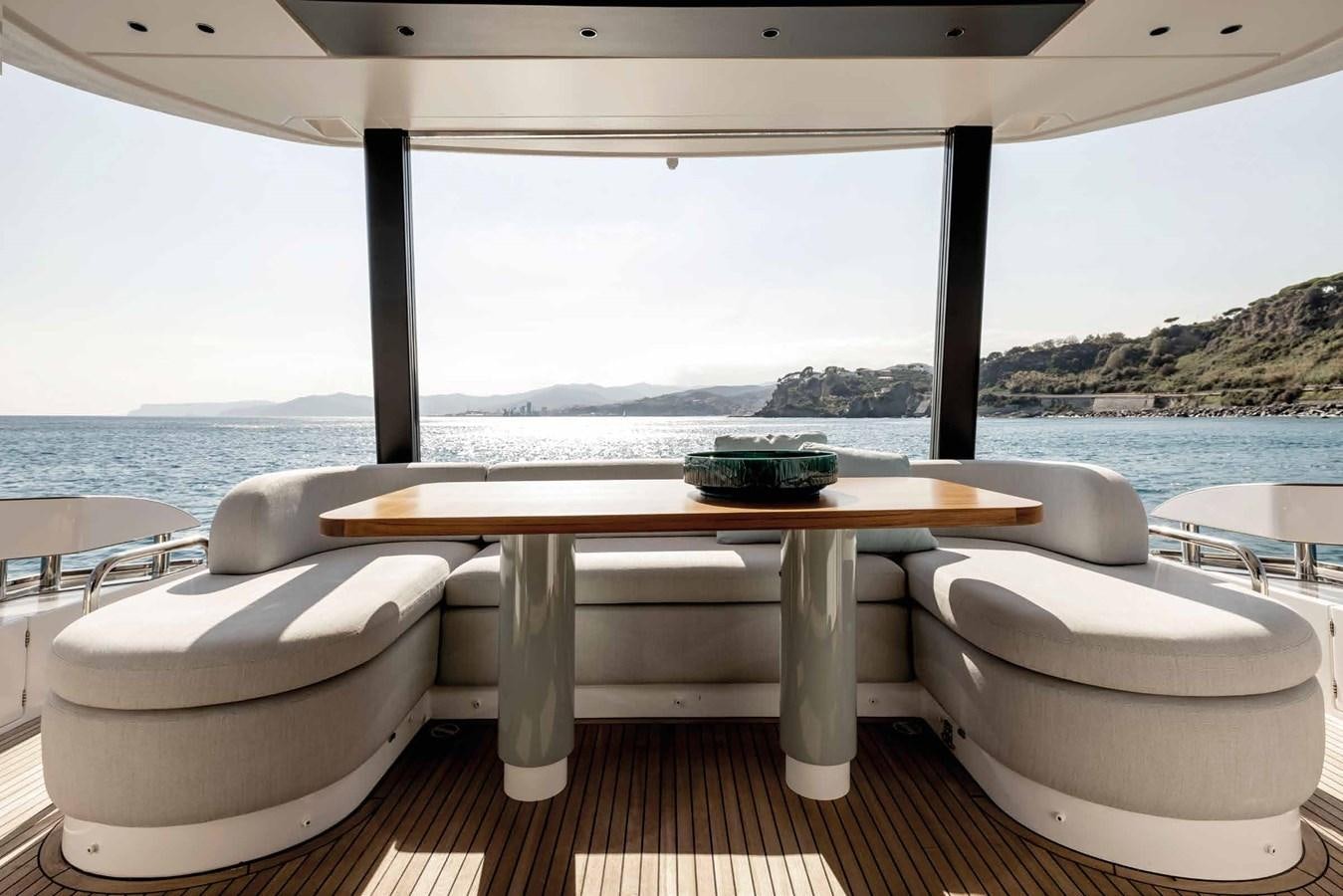 a table and chairs on a deck aboard AZIMUT 72 Yacht for Sale