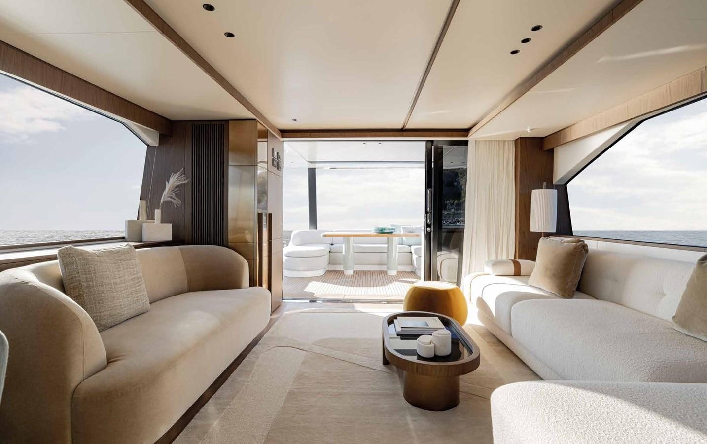 a living room with a large window aboard AZIMUT 72 Yacht for Sale