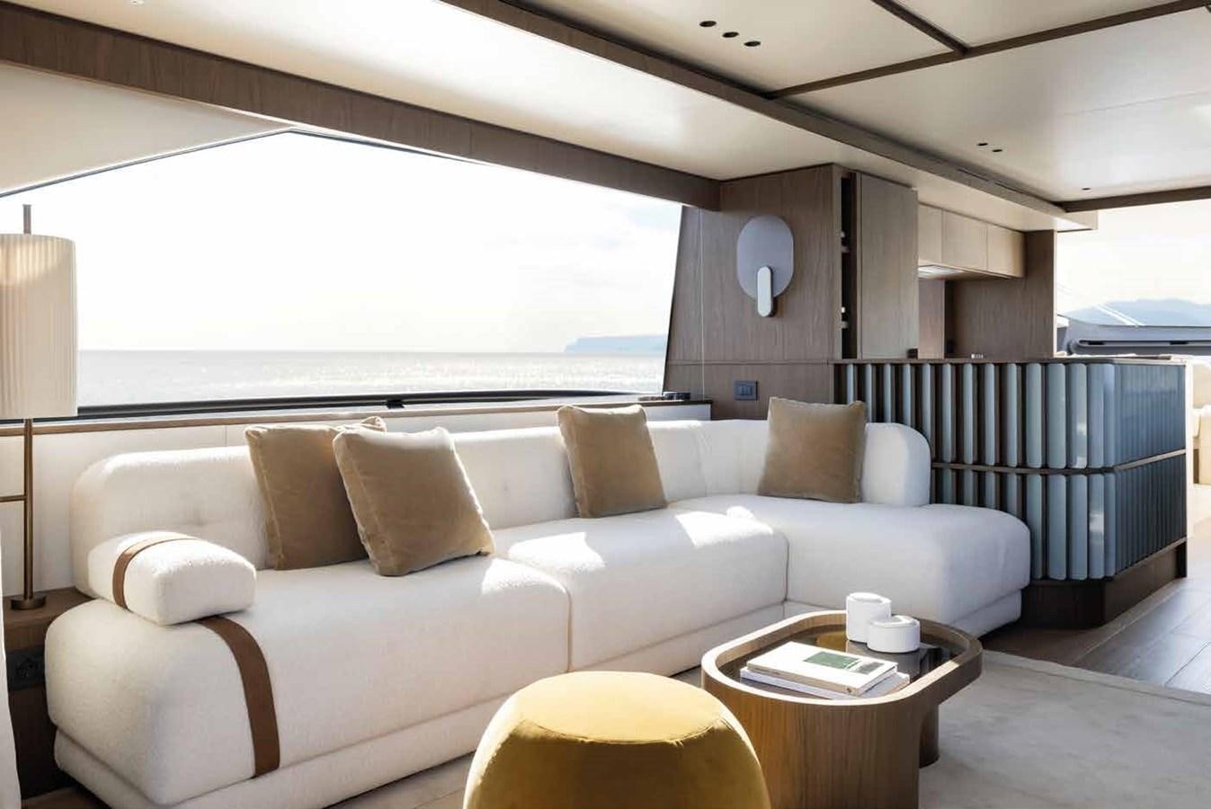 a living room with a large window aboard AZIMUT 72 Yacht for Sale