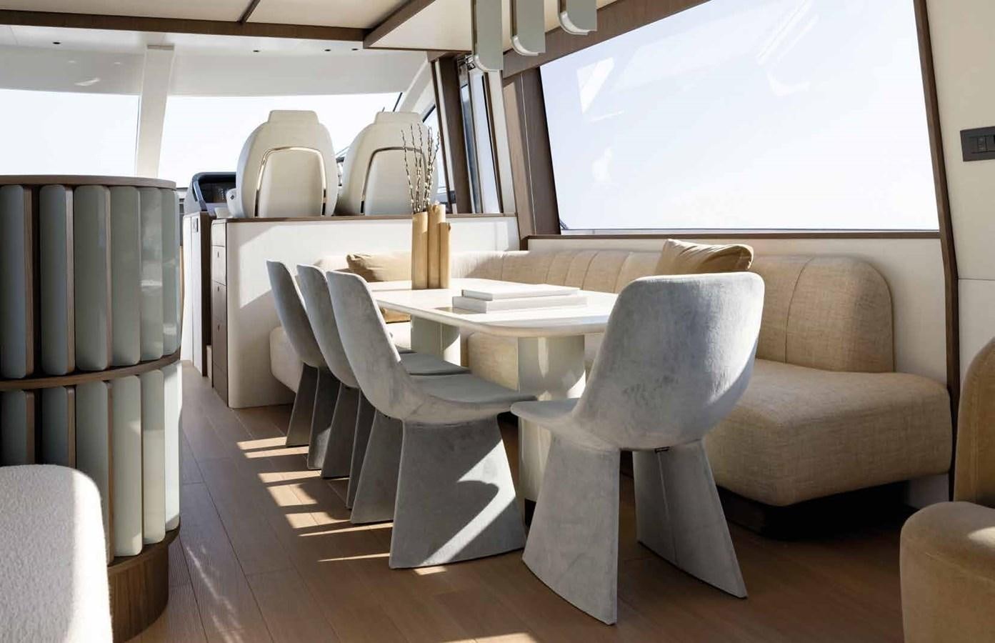 a room with a table and chairs aboard AZIMUT 72 Yacht for Sale