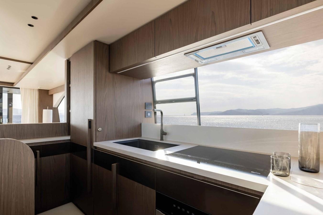 a kitchen with a large window aboard AZIMUT 72 Yacht for Sale