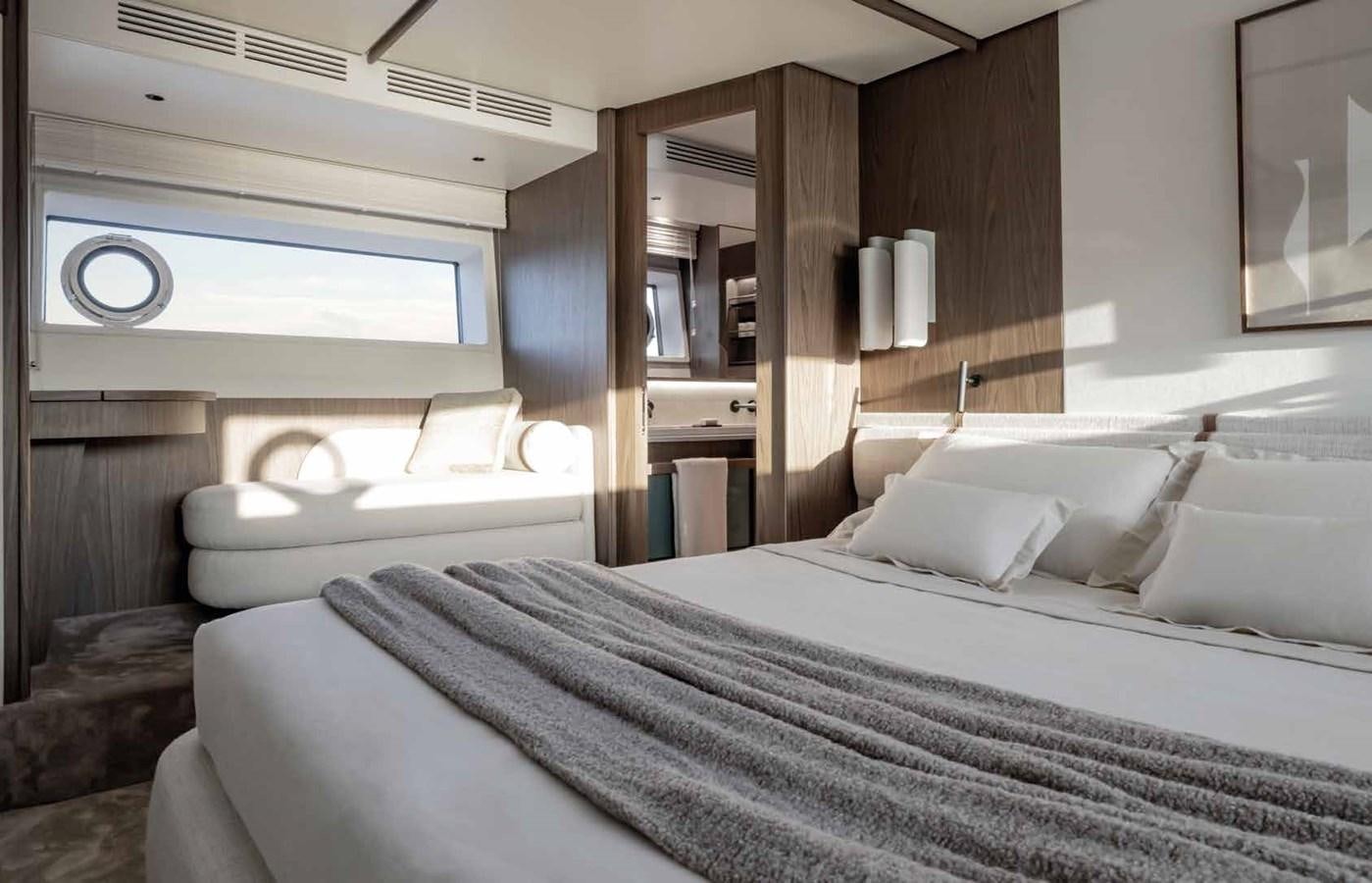 a room with a bed and a mirror aboard AZIMUT 72 Yacht for Sale