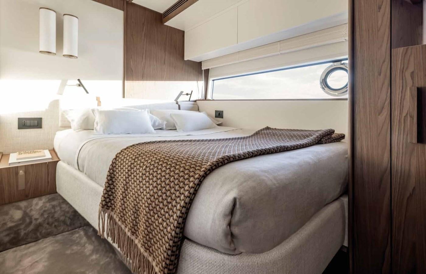 a bed with a couple of pillows aboard AZIMUT 72 Yacht for Sale