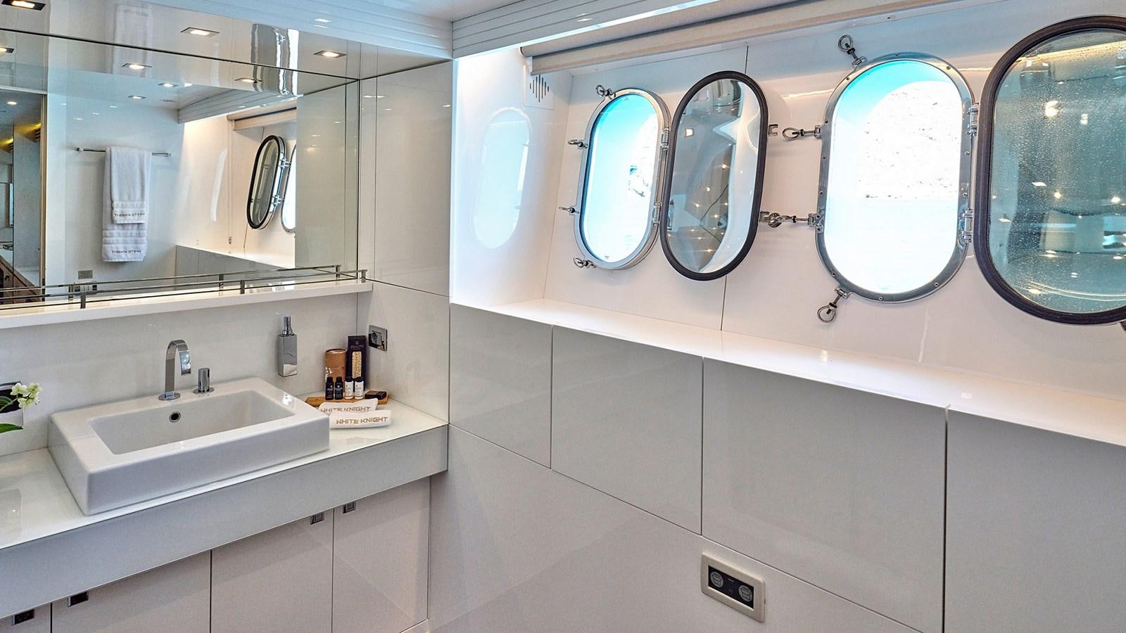 a bathroom with two sinks aboard WHITE KNIGHT Yacht for Sale