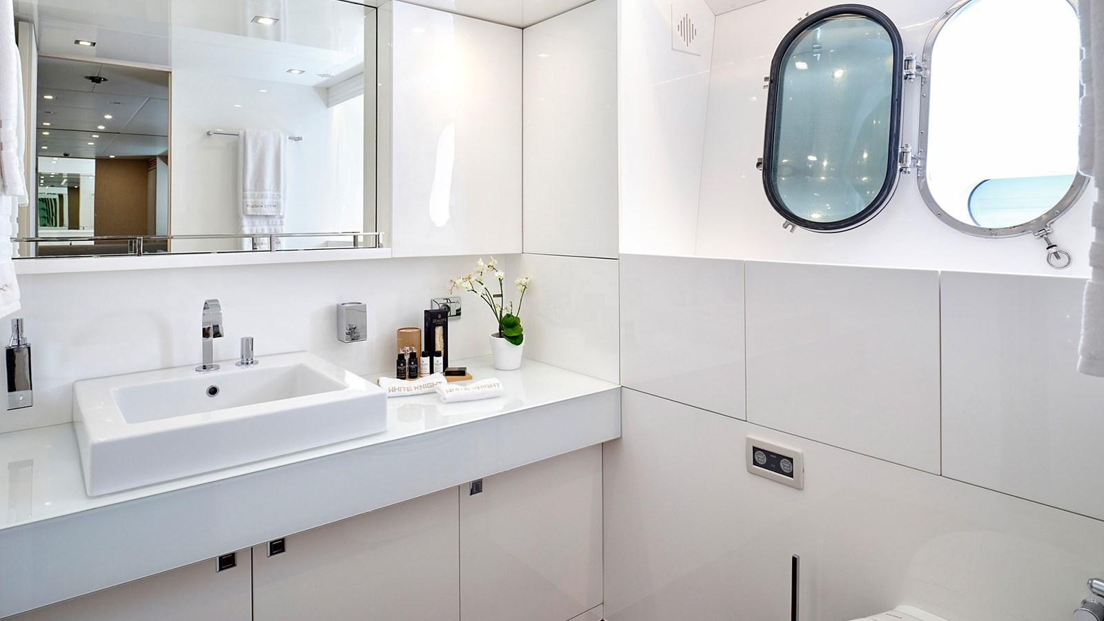 a bathroom with two sinks aboard WHITE KNIGHT Yacht for Sale