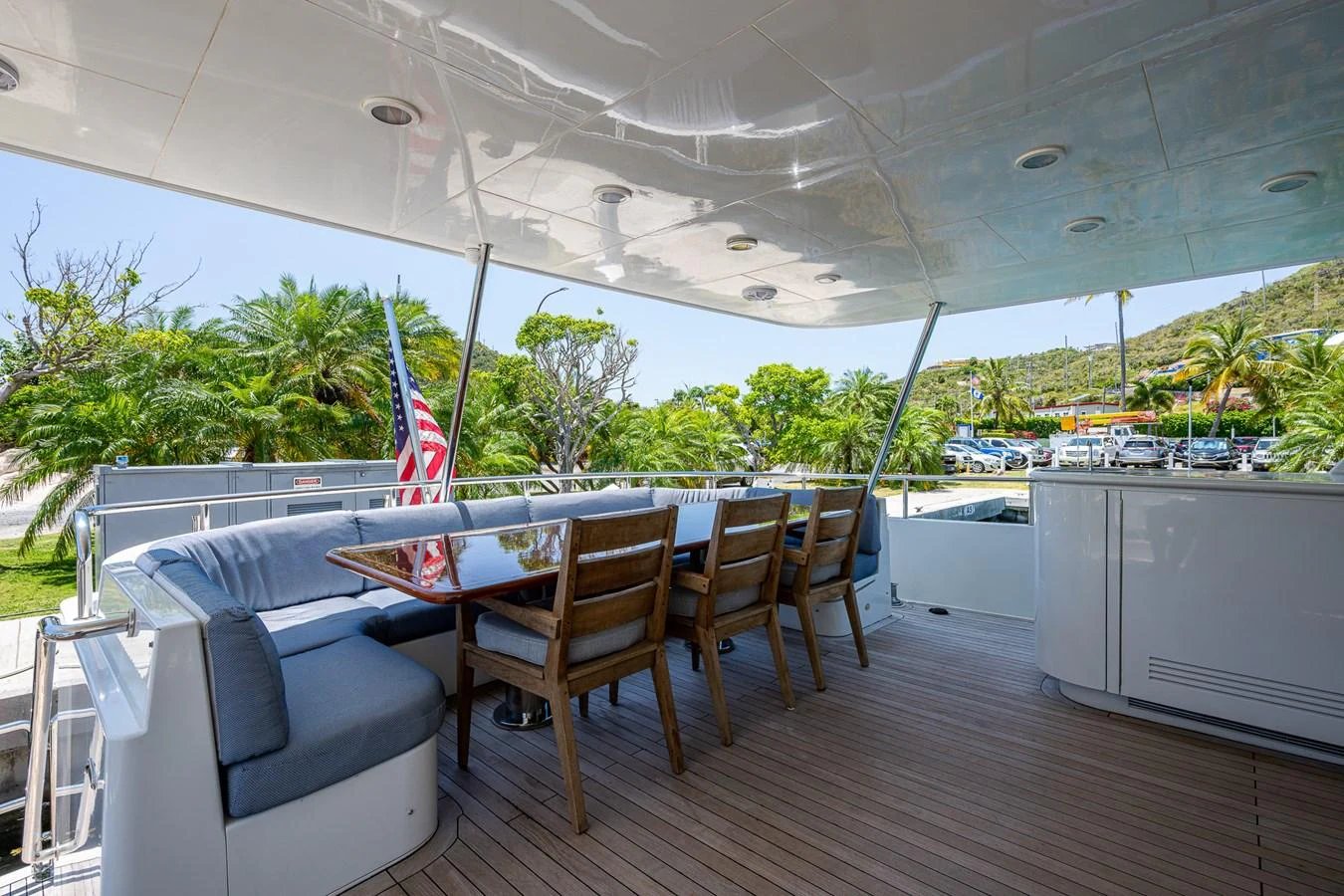 a deck with a table and chairs aboard LADY LORRAINE Yacht for Sale