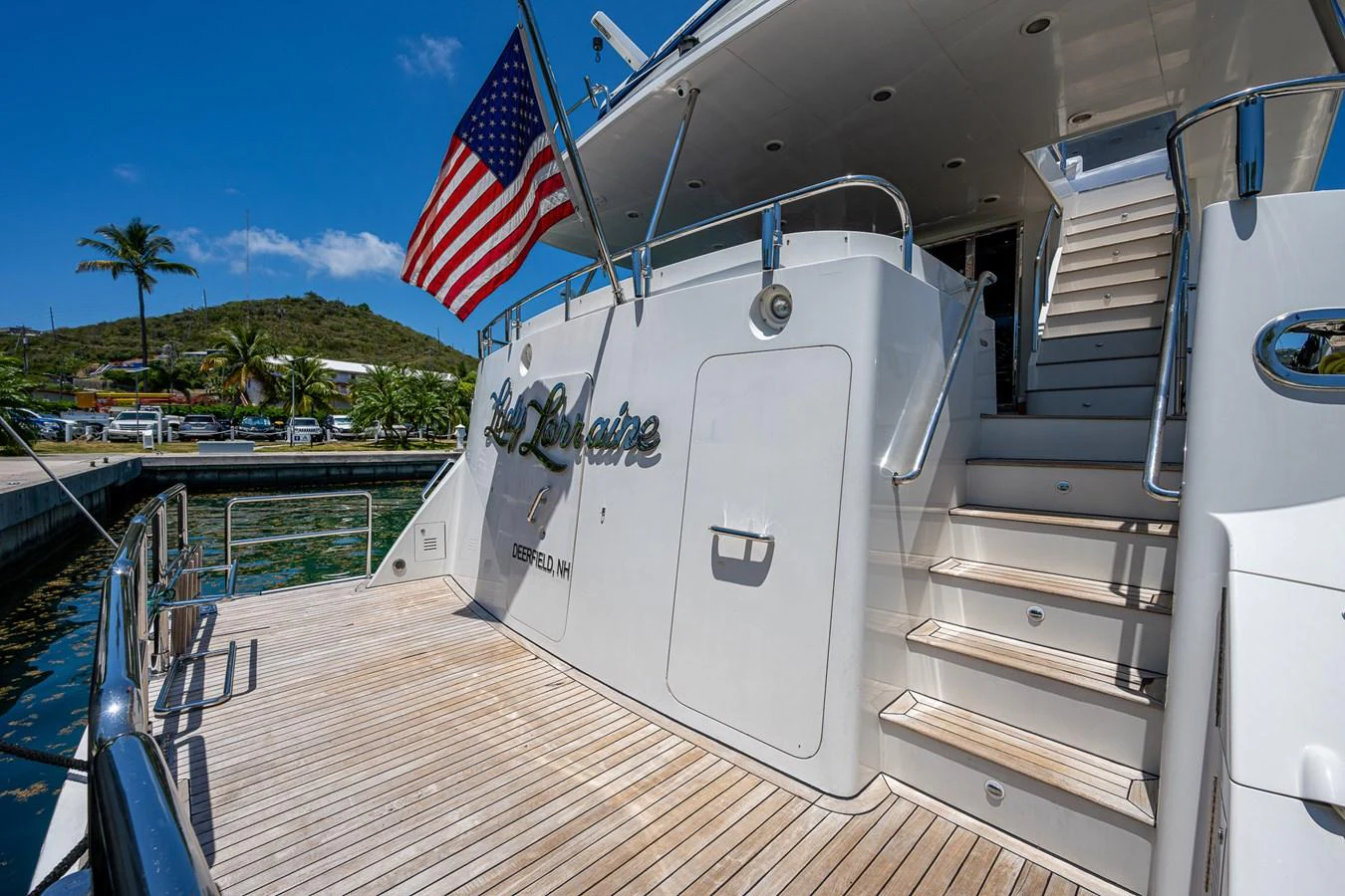 a boat with a flag on the front aboard LADY LORRAINE Yacht for Sale