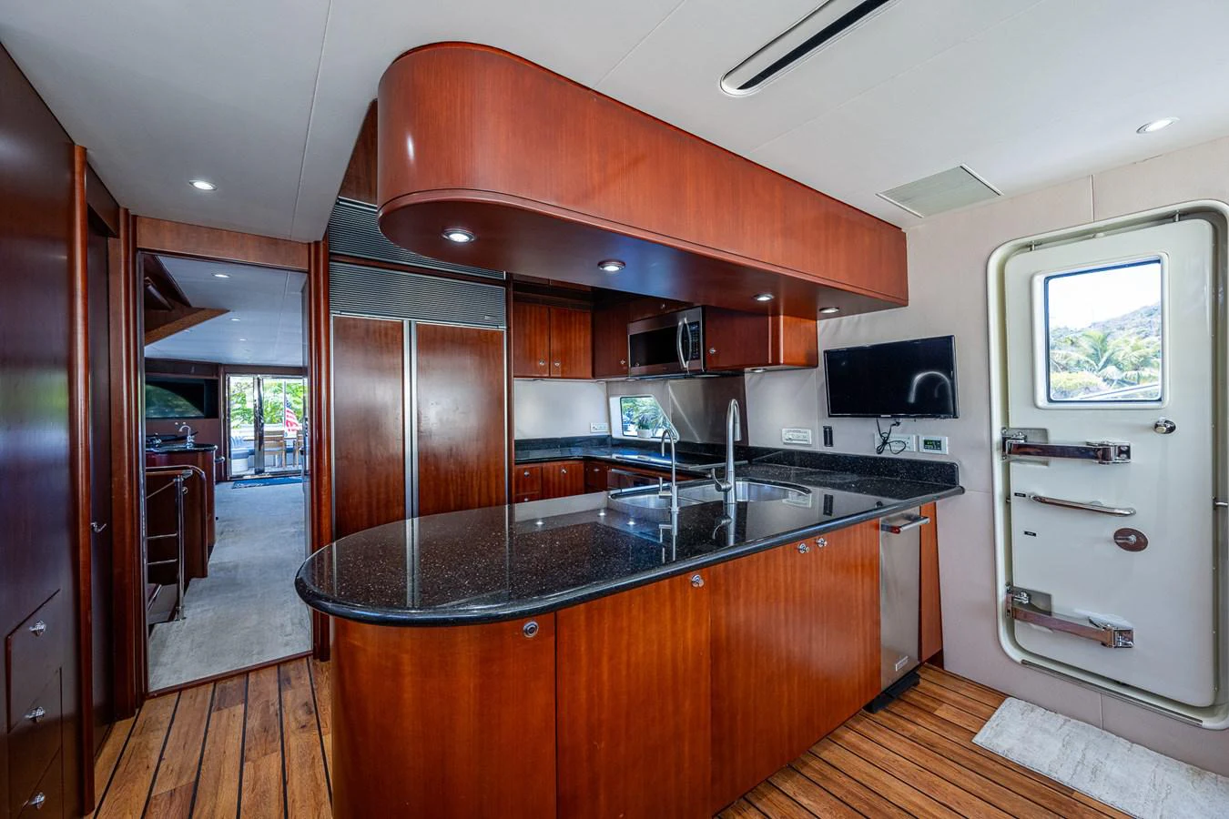 a kitchen with a large island aboard LADY LORRAINE Yacht for Sale