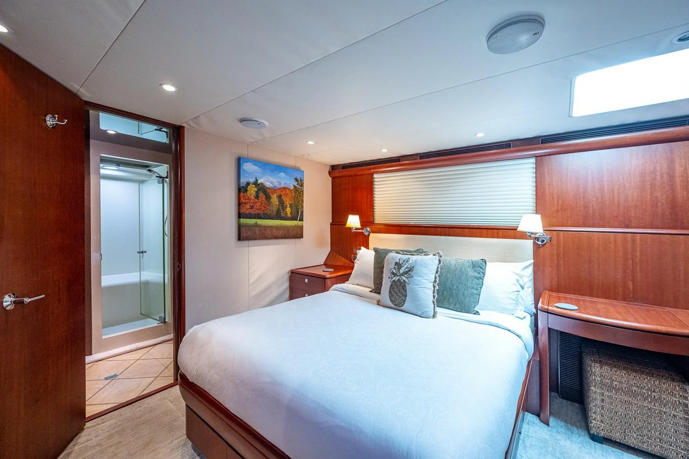 a bedroom with a bed and a bench aboard LADY LORRAINE Yacht for Sale
