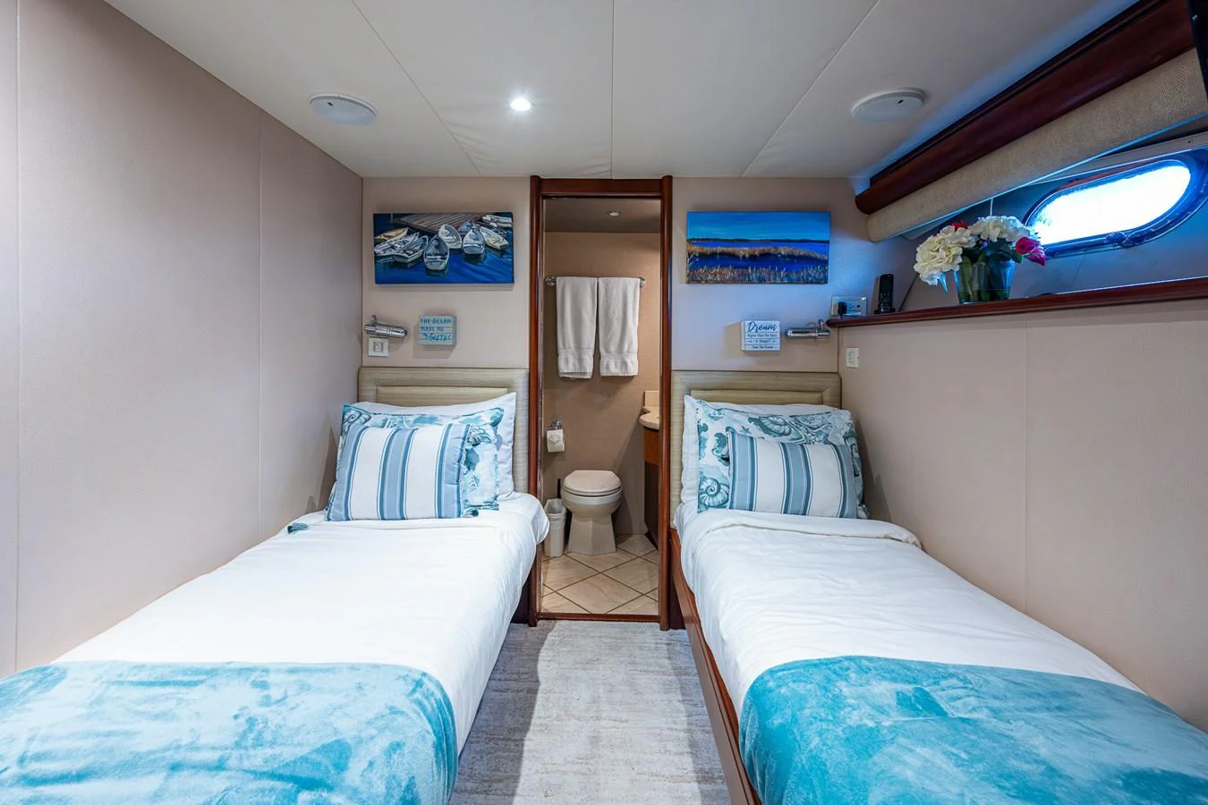 a room with a bed and a mirror aboard LADY LORRAINE Yacht for Sale