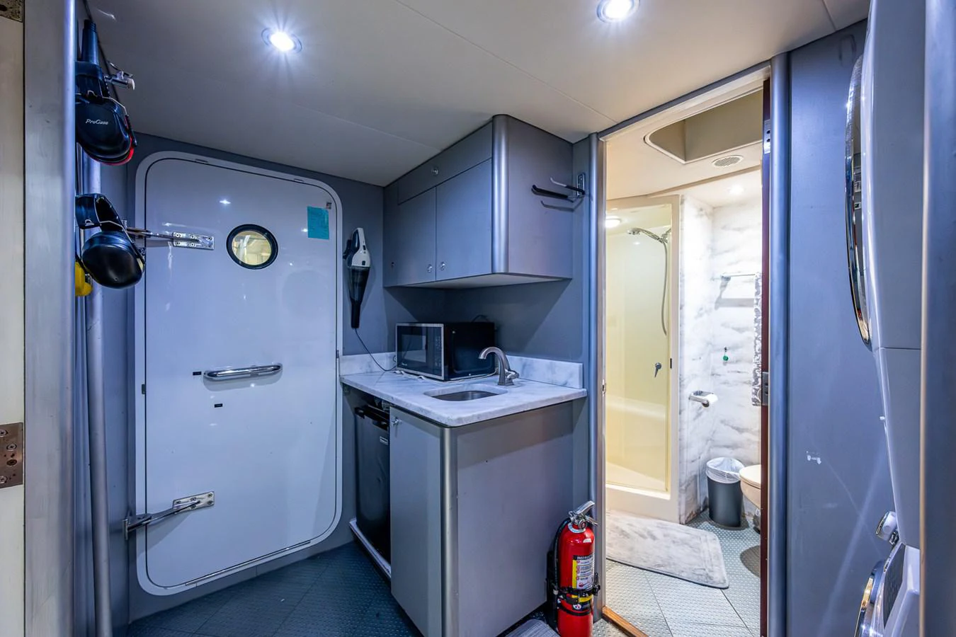 a kitchen with a sink and a refrigerator aboard LADY LORRAINE Yacht for Sale