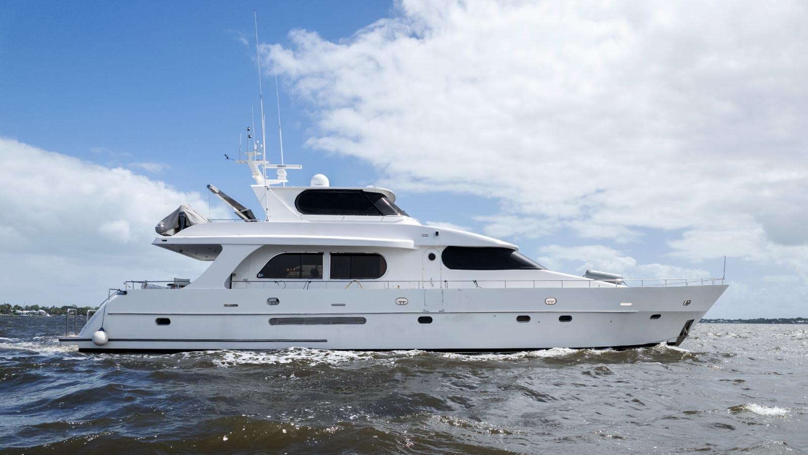 a white yacht on the water aboard CINNABAR VI Yacht for Sale