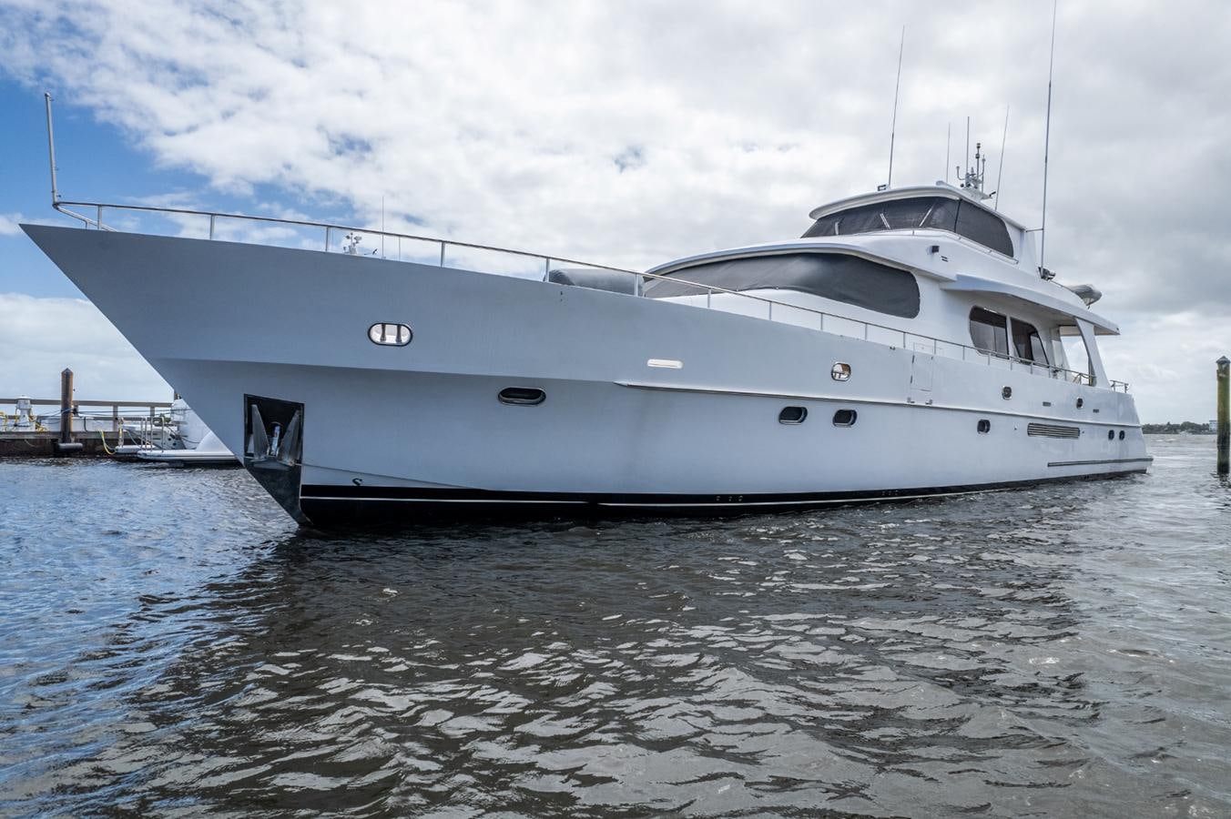 a white yacht in the water aboard CINNABAR VI Yacht for Sale