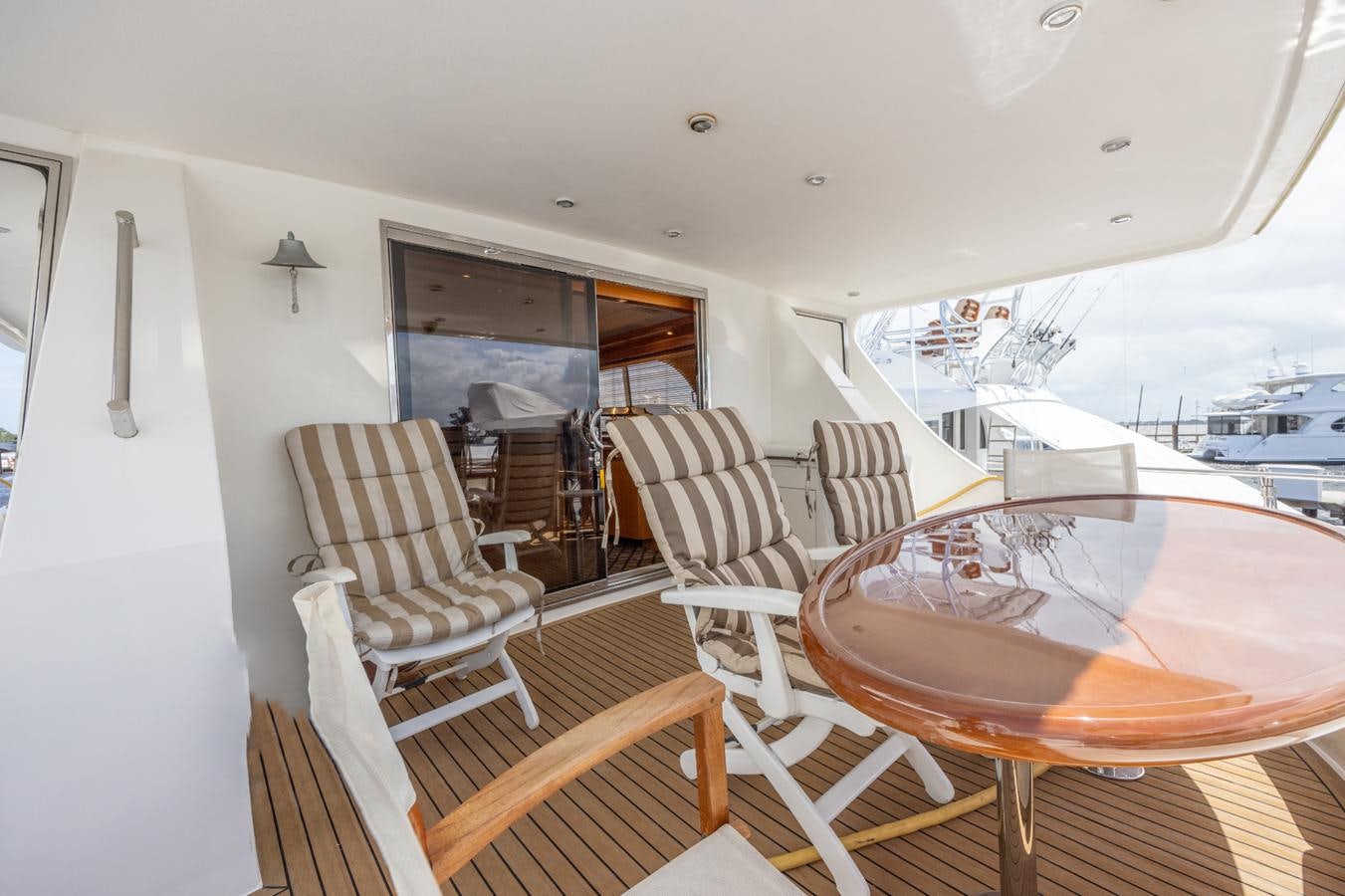 a large living room with a large screen aboard CINNABAR VI Yacht for Sale