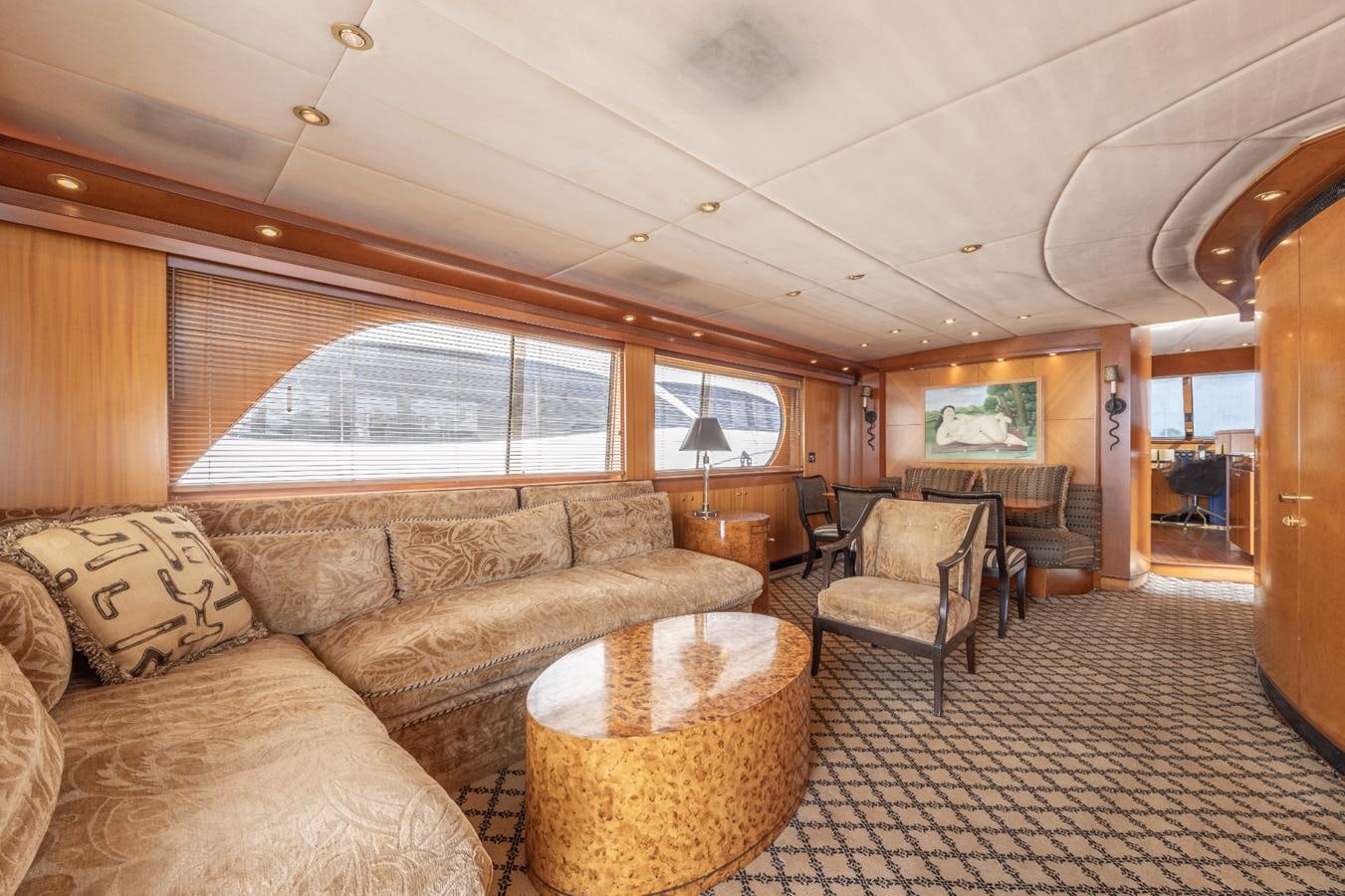 a living room with a couch and a table aboard CINNABAR VI Yacht for Sale