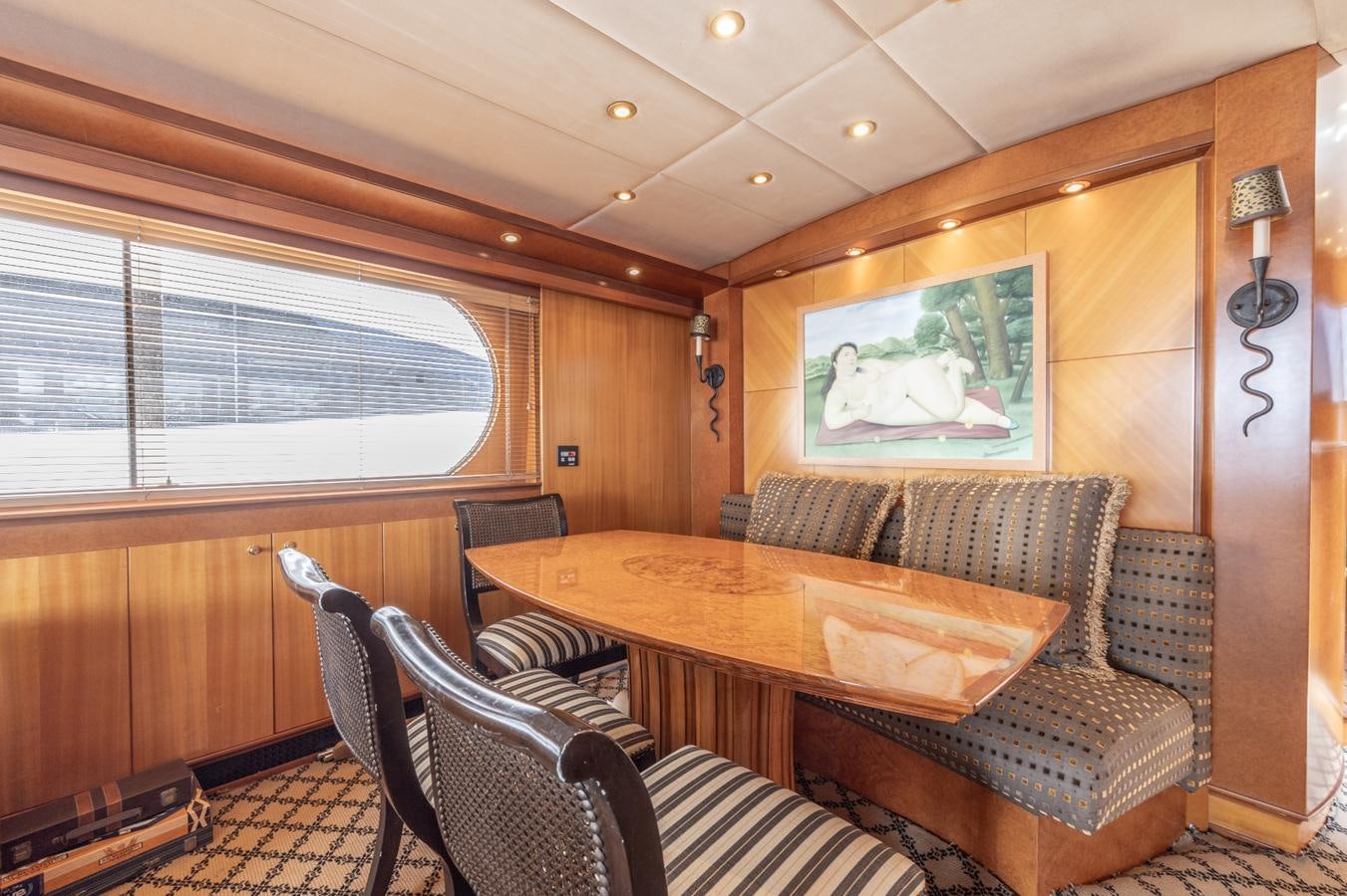 a dining table in a living room aboard CINNABAR VI Yacht for Sale