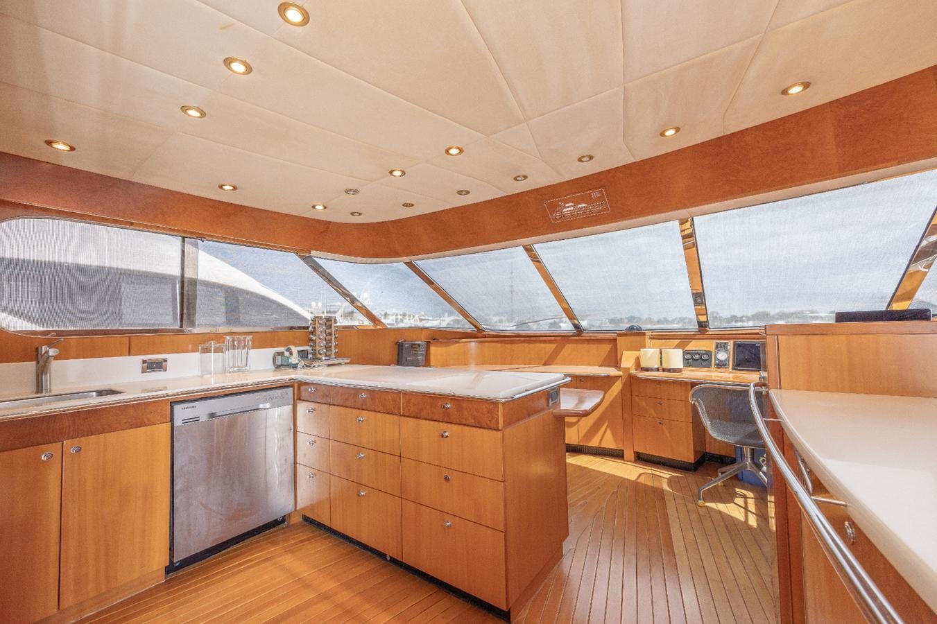 a kitchen with wooden cabinets aboard CINNABAR VI Yacht for Sale